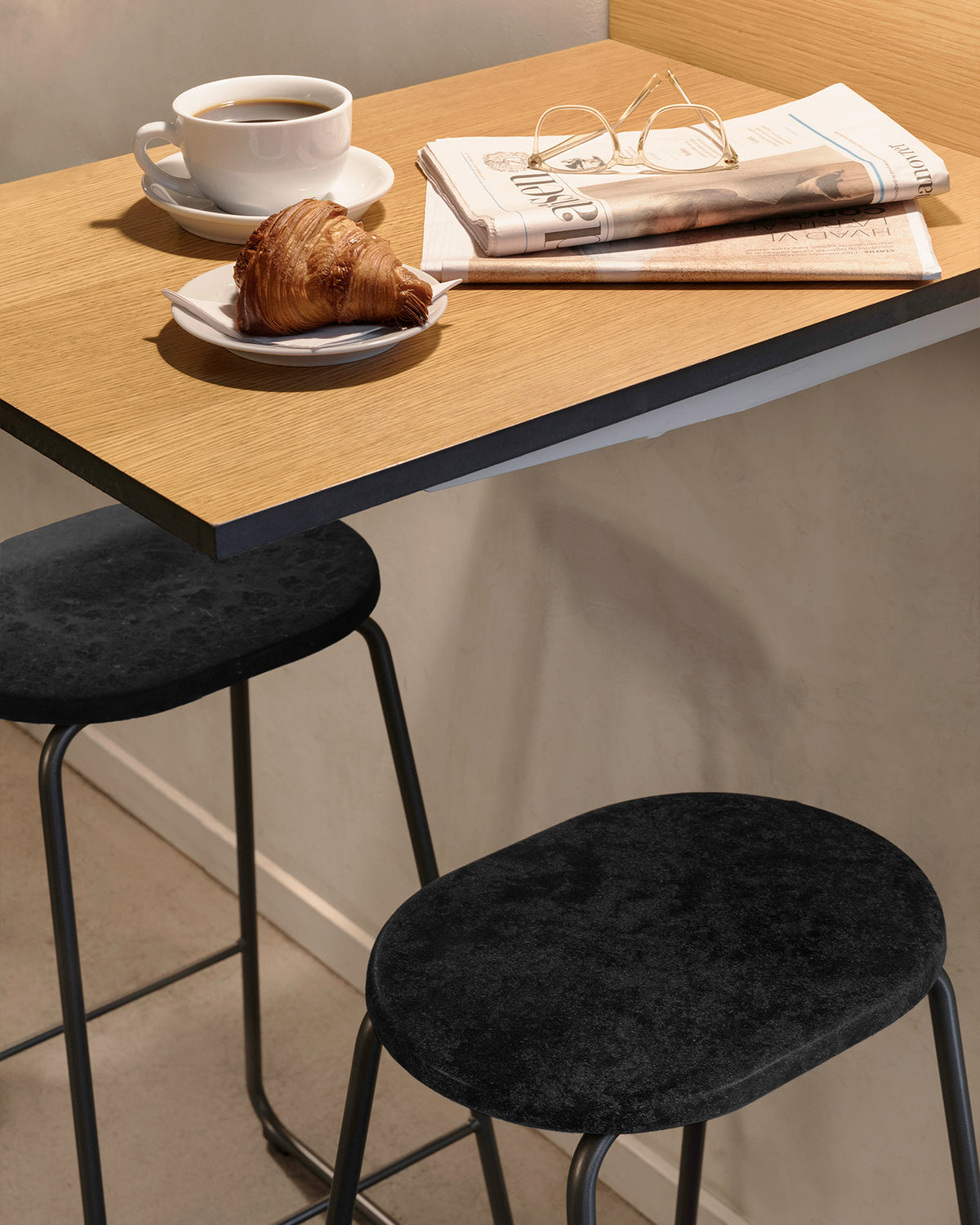 Earth Stool 69 cm in Coffee Waste Black, in an interior setting