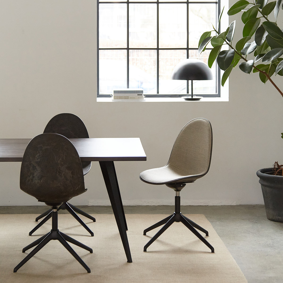 Eternity Swivel in Coffee Waste Black with front upholstery, black base, side view